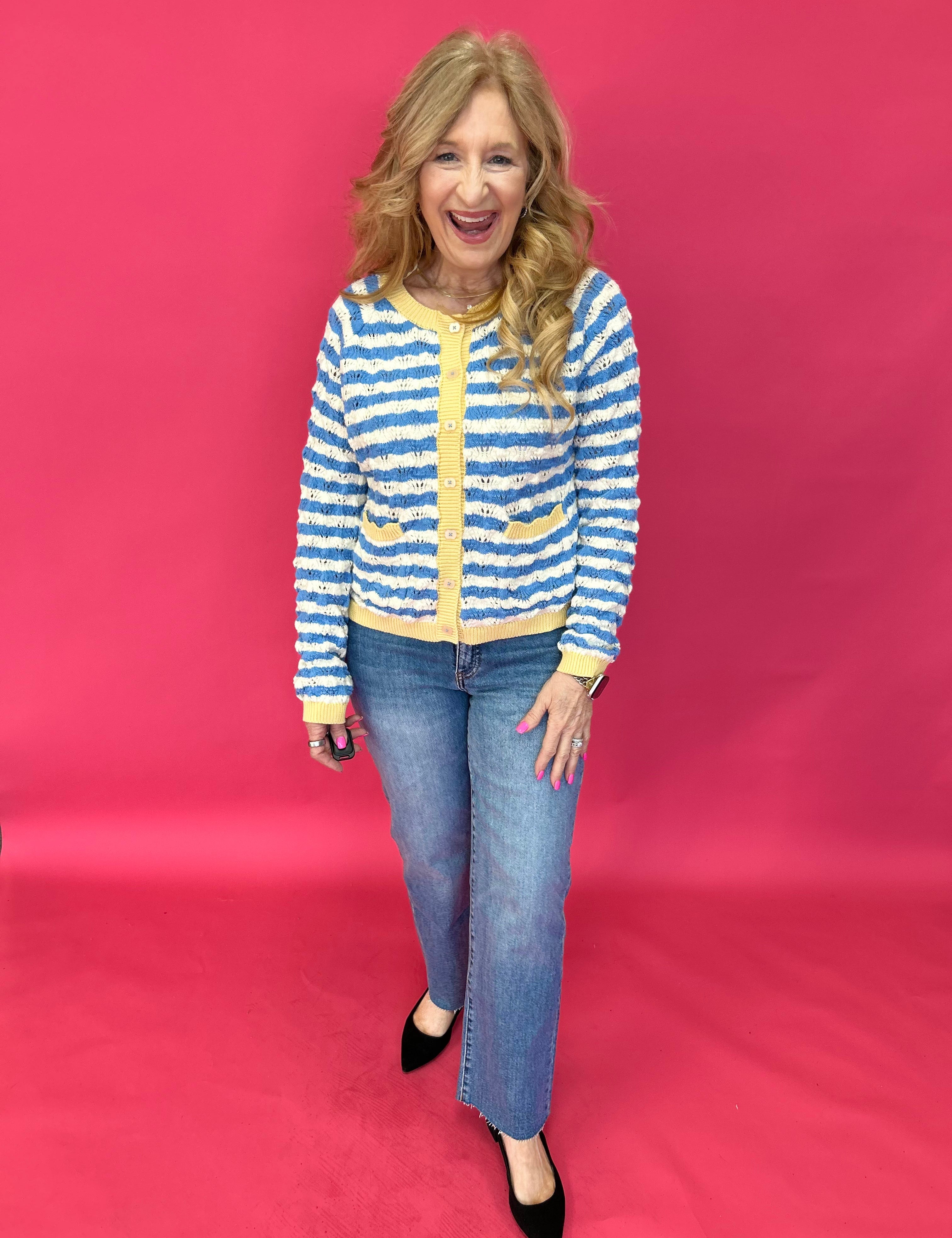 Back view of the medium wash straight jeans showing five pocket styling and a relaxed seat