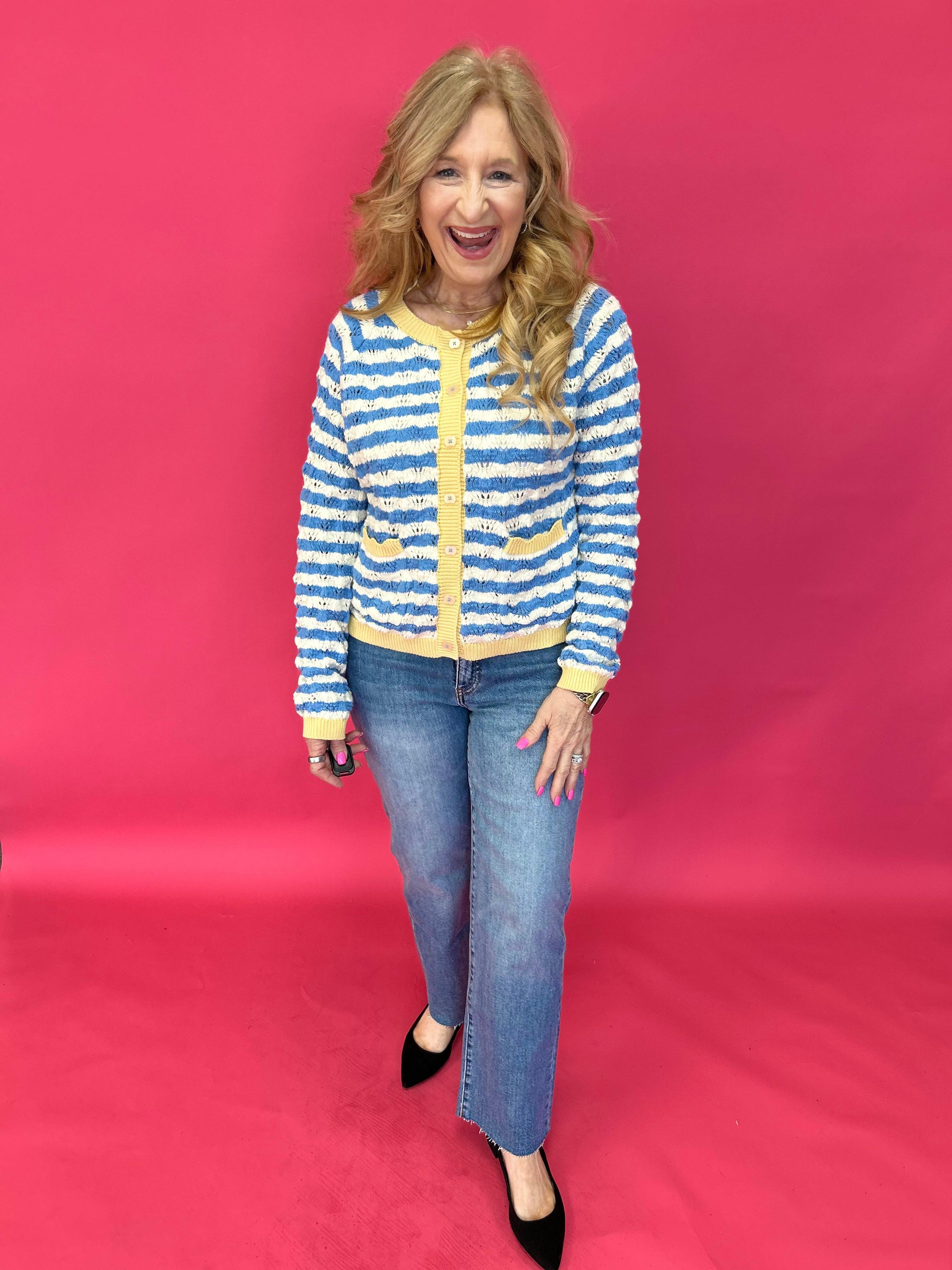 Back view of the medium wash straight jeans showing five pocket styling and a relaxed seat