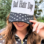 Black and white trucker hat with puff-embroidered Bad Hair Day lettering and polka dot bill – Shabby 2 Chic Boutiques