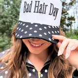 Black and white trucker hat with puff-embroidered Bad Hair Day lettering and polka dot bill – Shabby 2 Chic Boutiques