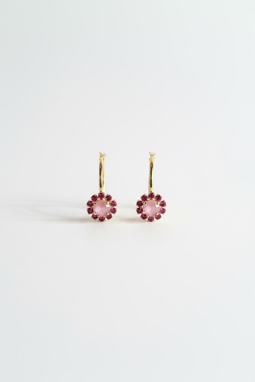 Antique gold hoop earrings covered in petal pink crystals measuring an inch and a half
