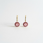 Antique gold hoop earrings covered in petal pink crystals measuring an inch and a half