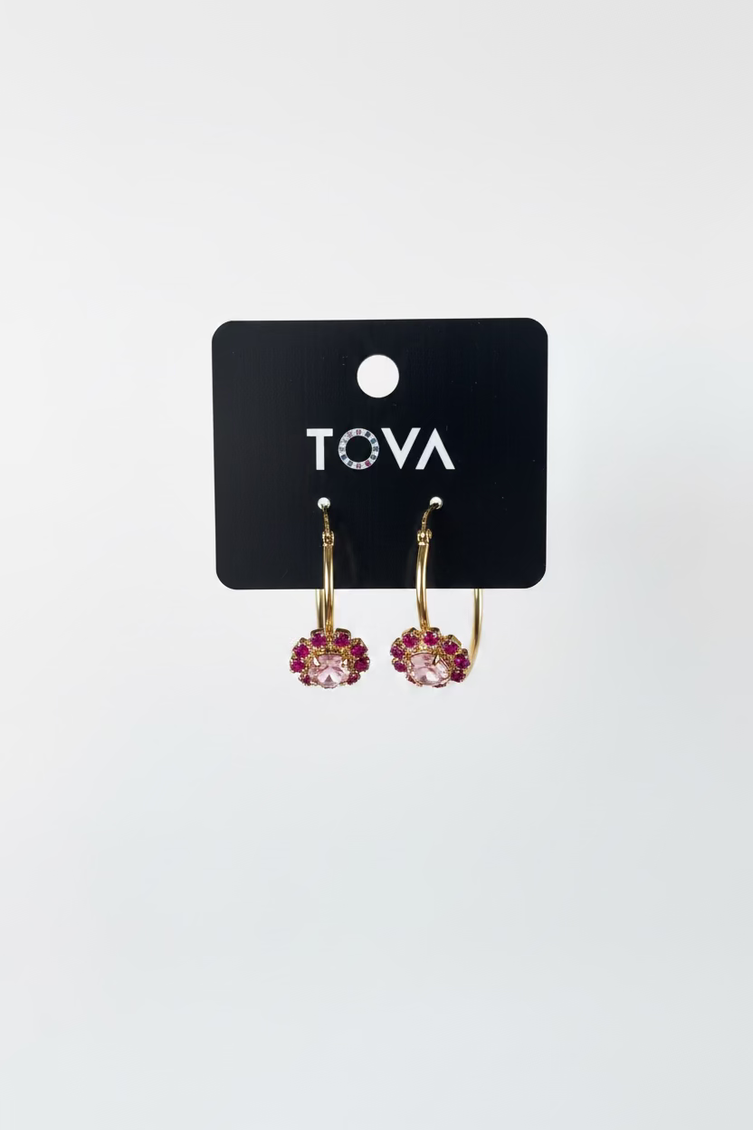 Close-up of the pink crystal pave and the antique gold brass finish on the Bianca hoop