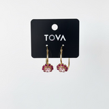 Close-up of the pink crystal pave and the antique gold brass finish on the Bianca hoop