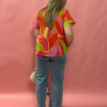 Bloom & Flow: Bright Floral Mini Pleat Tie-Front Blouse