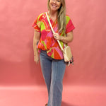 Bloom & Flow: Bright Floral Mini Pleat Tie-Front Blouse