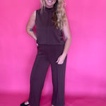 Detail of the elastic waistband and side pocket opening on the brown sugar trousers