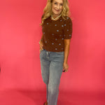 Cocoa brown polka dot cardigan styled buttoned over trousers for an office-ready fall look