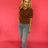 Cocoa brown polka dot cardigan styled buttoned over trousers for an office-ready fall look