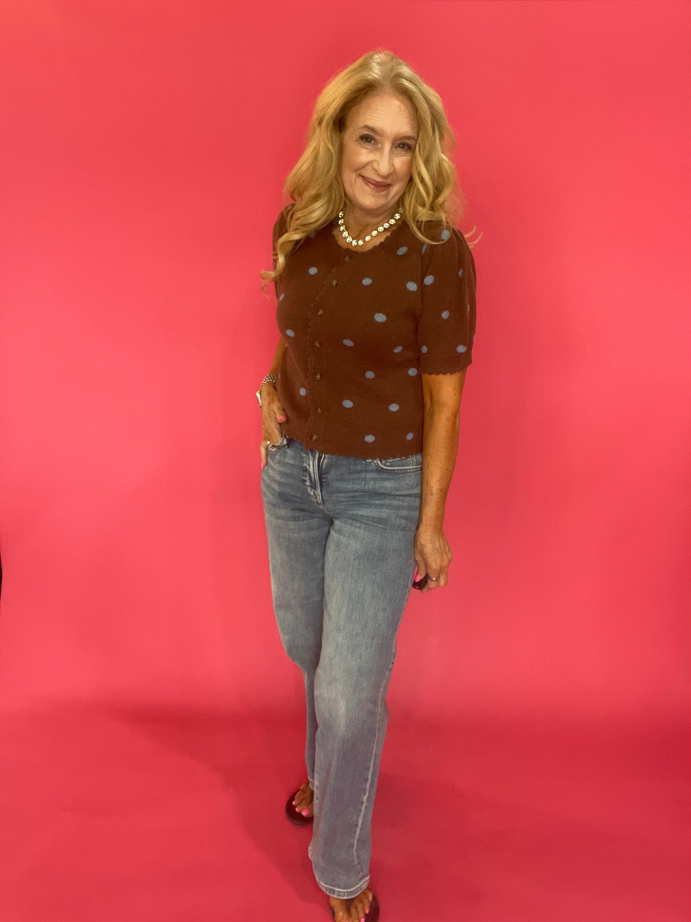 Cocoa brown polka dot cardigan styled buttoned over trousers for an office-ready fall look