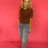 Cocoa brown polka dot cardigan styled buttoned over trousers for an office-ready fall look