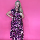 Side view showing the movement in the skirt of the brown floral midi dress