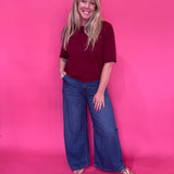Back view of the burgundy knit pullover sweater showing the easy relaxed body and shoulders