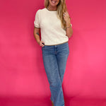Back view of the oatmeal knit pullover sweater showing the relaxed drop shoulder and easy body