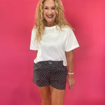 Close-up of the black and white mini polka dot print on the lightweight boxer lounge shorts