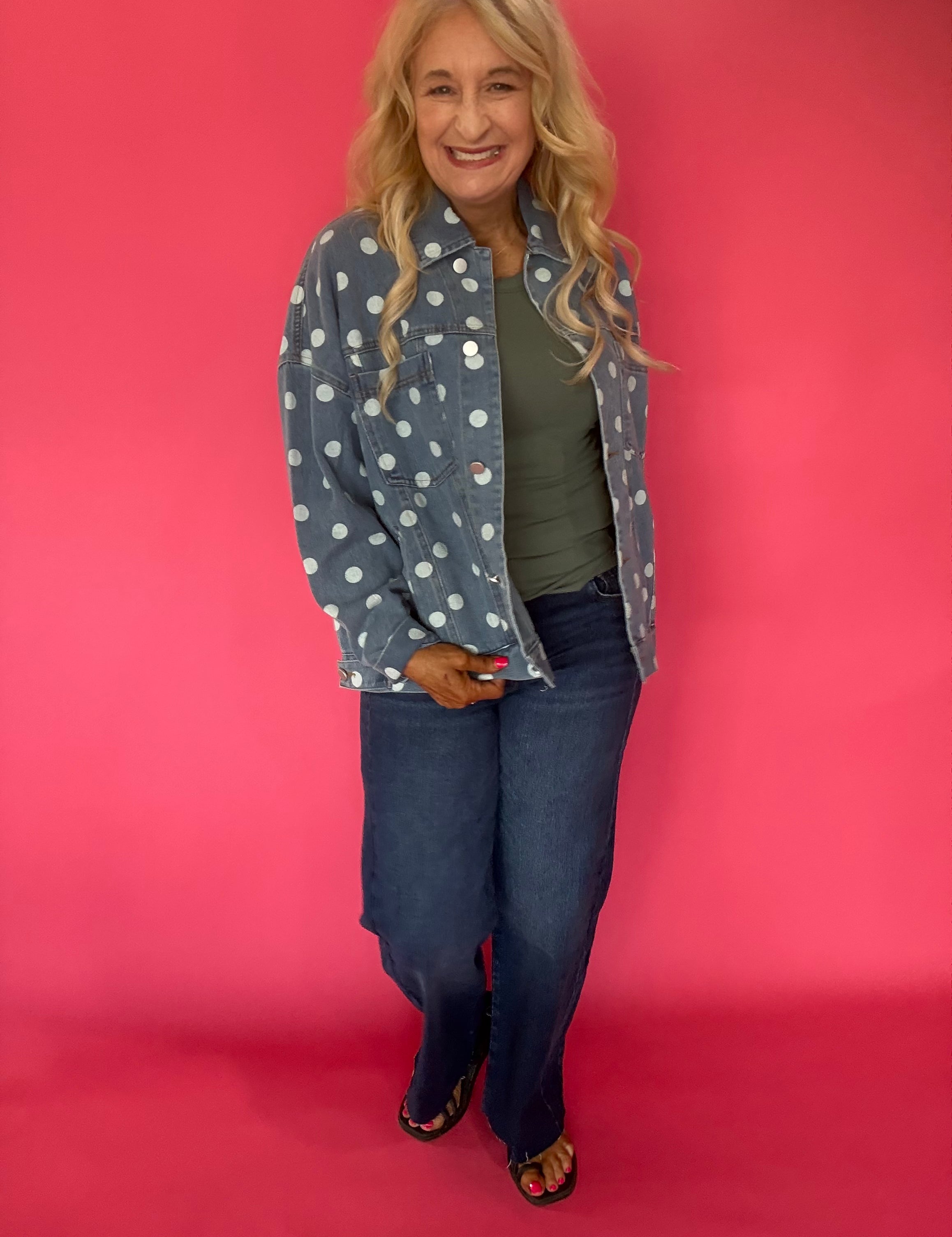 Back view of the light denim polka dot jacket showing the relaxed oversized cut and classic collar
