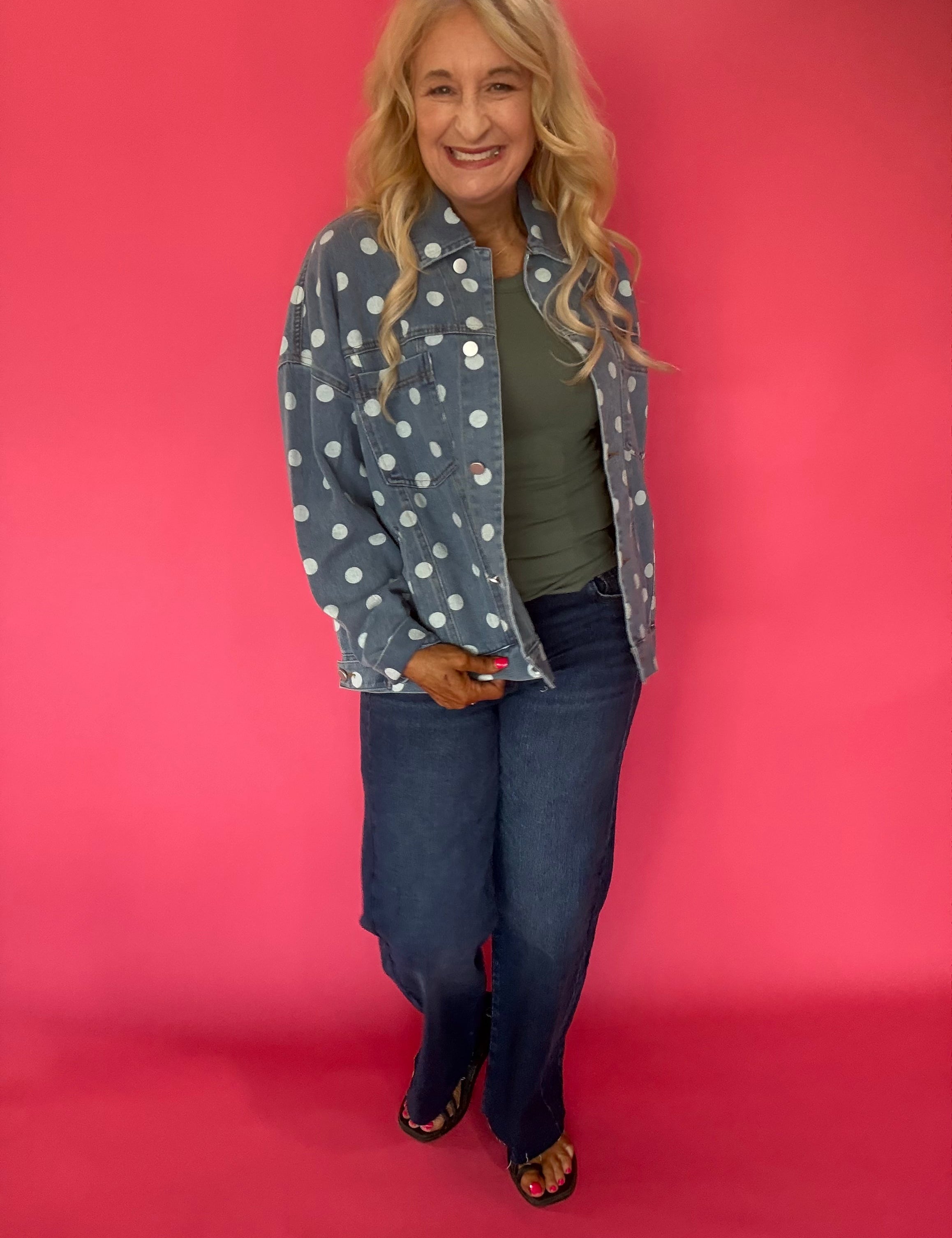 Back view of the light denim polka dot jacket showing the relaxed oversized cut and classic collar