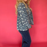 Side view showing the roomy sleeve and everyday weight denim of the light wash dot jacket