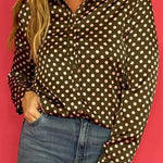 Back view of the olive satin polka dot shirt showing its relaxed button down cut