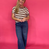 Detail of the stripe pattern and soft cotton knit on the oversized rust striped tee