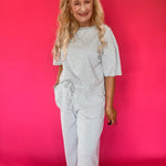 Detail of the short sleeve and neckline on the striped ribbed knit lounge set top