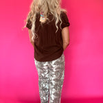 Flat lay of the brown lightweight woven blouse showing the sleeve length and hemline