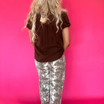 Flat lay of the brown lightweight woven blouse showing the sleeve length and hemline