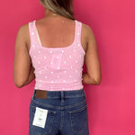 Flat lay of the medium dark wash high rise denim shorts showing the raw hem and pockets