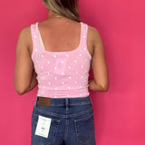 Flat lay of the medium dark wash high rise denim shorts showing the raw hem and pockets