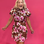 Side view showing the soft drape and length of the brown floral dress