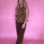 Wide-leg brown trousers that carry from a morning meeting to evening plans