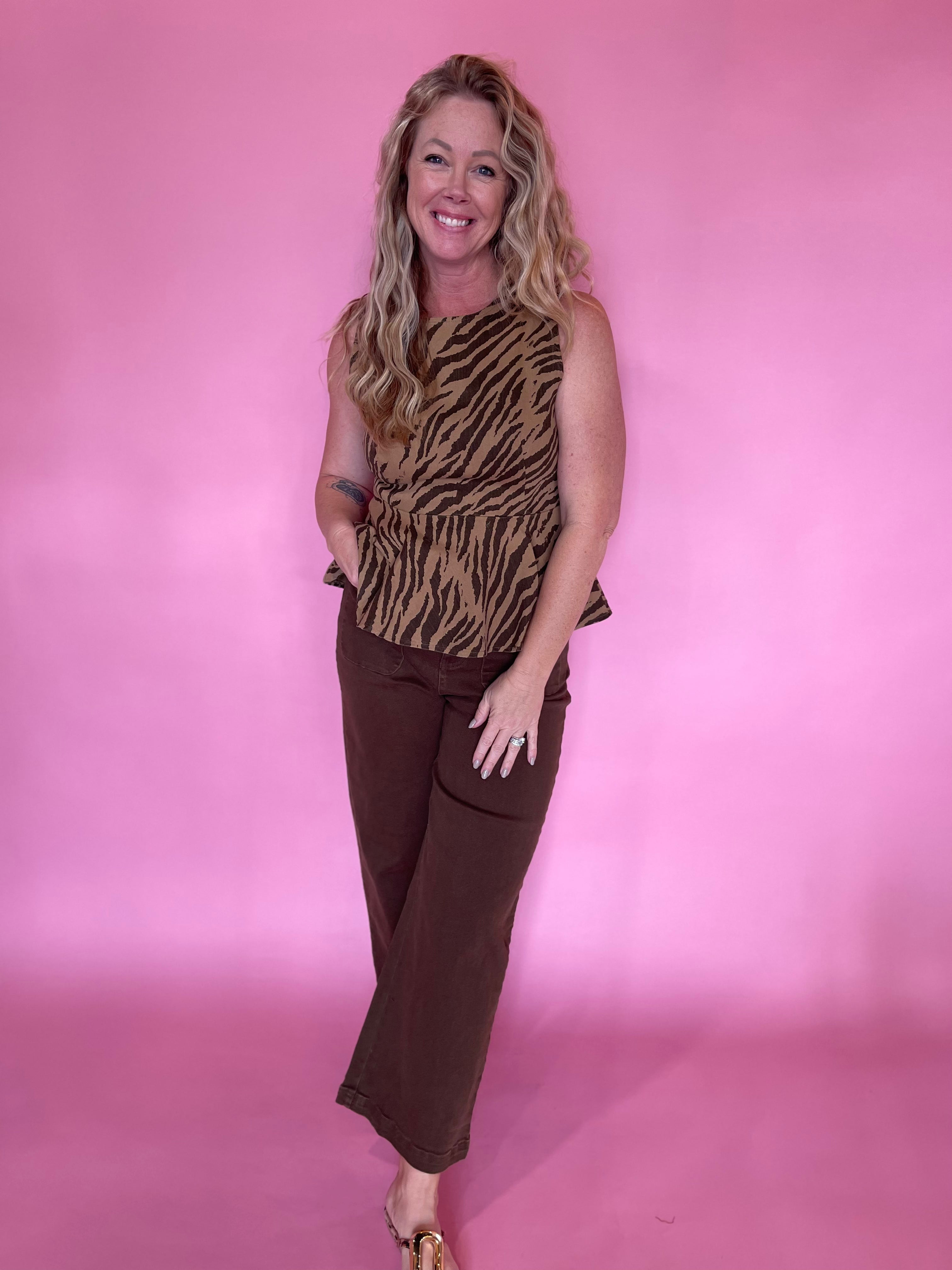 Wide-leg brown trousers that carry from a morning meeting to evening plans