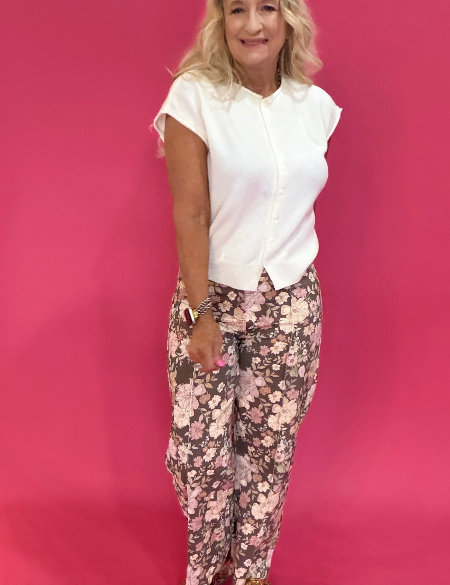 Back view of the brown floral print wide leg pants showing the long flowy leg drape