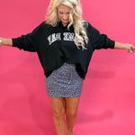 Back view of the game day French terry pullover showing the relaxed fit and side slit hem