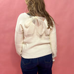 Elegance in Detail: Cream V-Neck Back Bow Tie Sweater