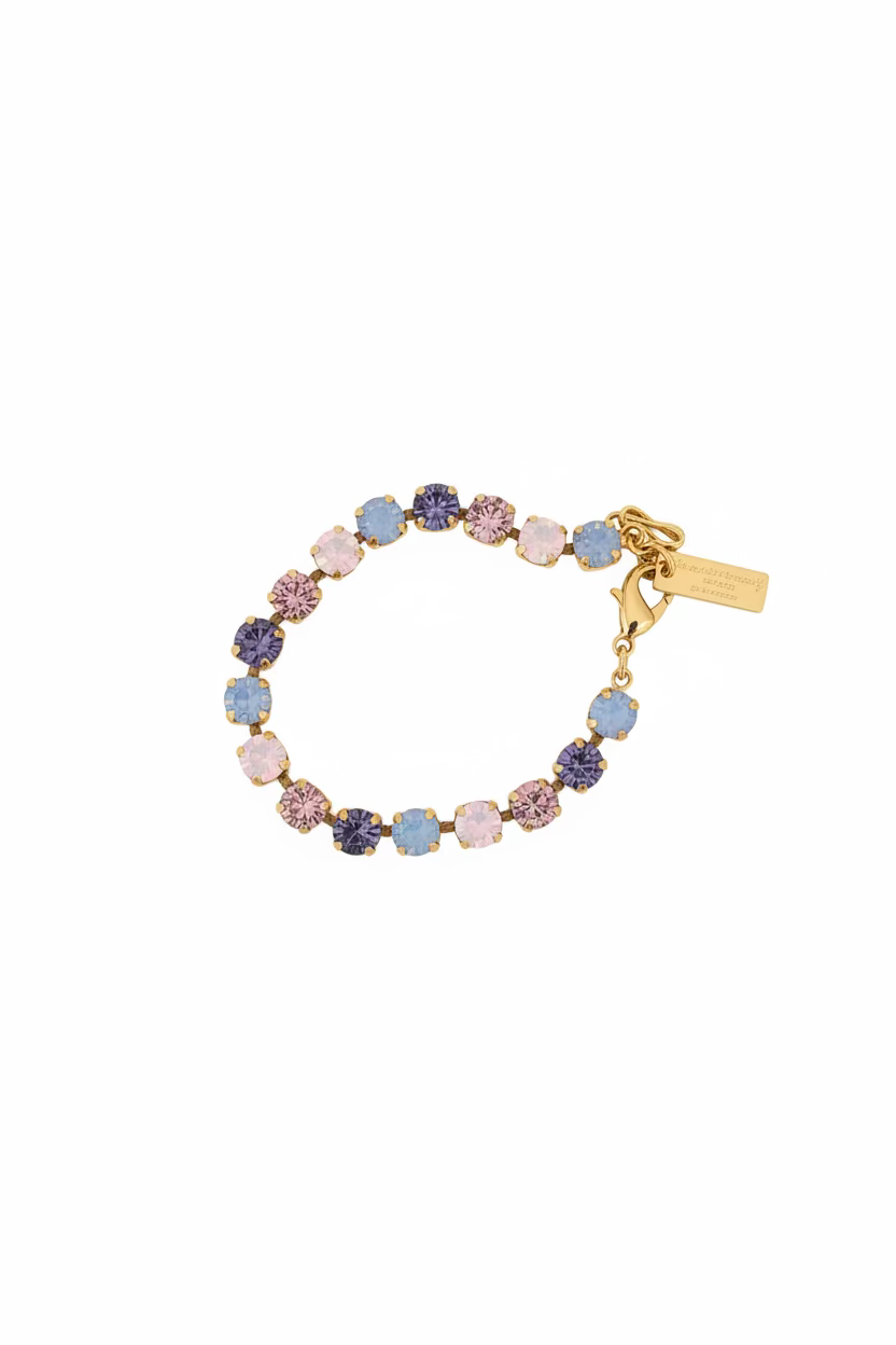 Close-up of the 8mm pink ombre stones set in antique gold plated brass on the Izzy bracelet