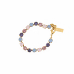 Close-up of the 8mm pink ombre stones set in antique gold plated brass on the Izzy bracelet