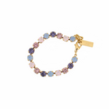 Close-up of the 8mm pink ombre stones set in antique gold plated brass on the Izzy bracelet