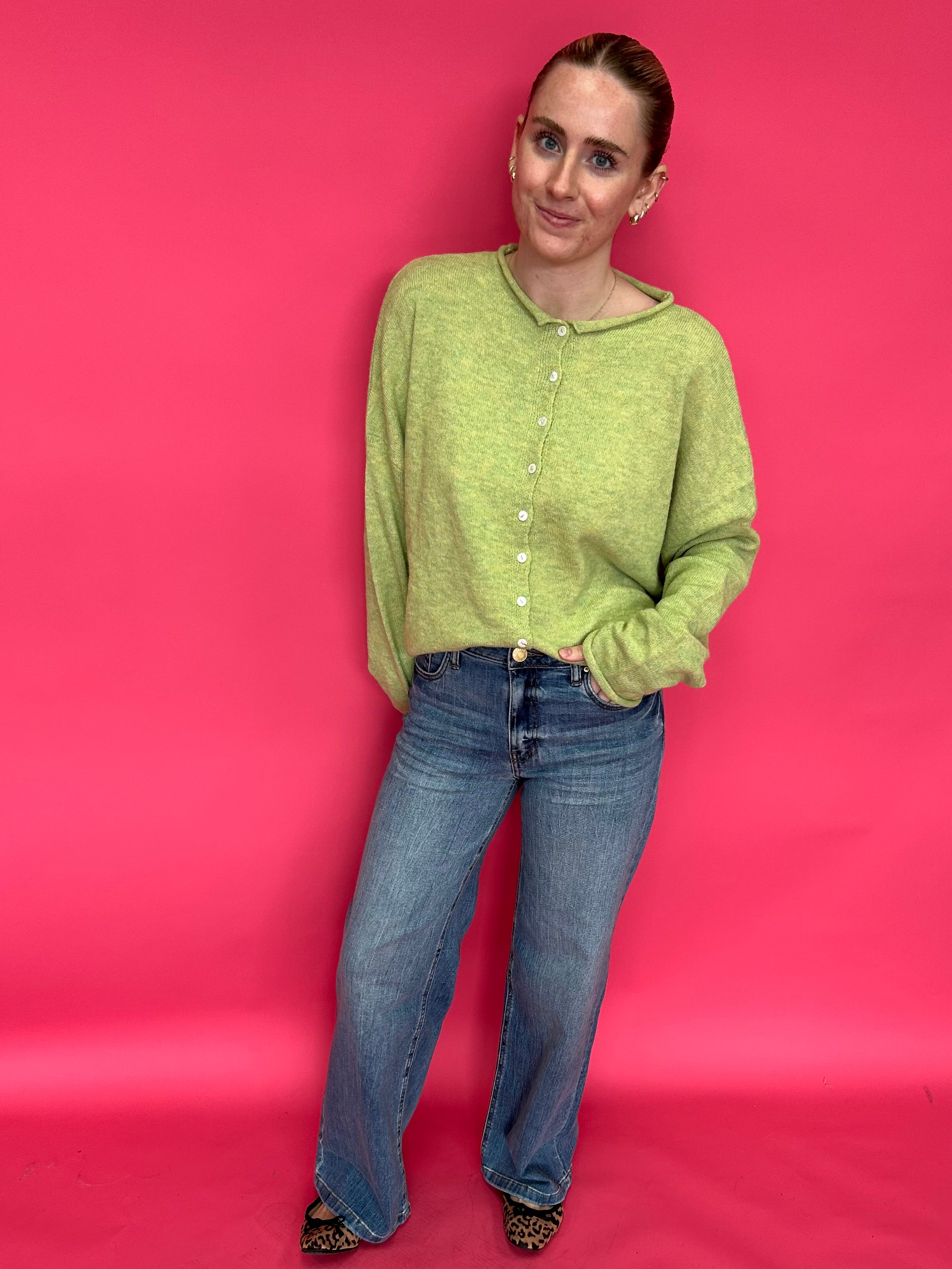 Close-up of the clean hem finish at the ankle on the high rise wide leg stretch denim jeans
