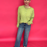 Detail of the Fab Ab front pockets and high rise waistband on the wide leg denim