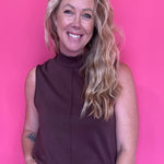 Woman wearing a warm brown everyday top tucked into denim with an easy relaxed fit