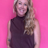 Woman wearing a warm brown everyday top tucked into denim with an easy relaxed fit