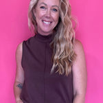 Woman wearing a warm brown everyday top tucked into denim with an easy relaxed fit