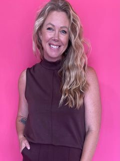 Woman wearing a warm brown everyday top tucked into denim with an easy relaxed fit