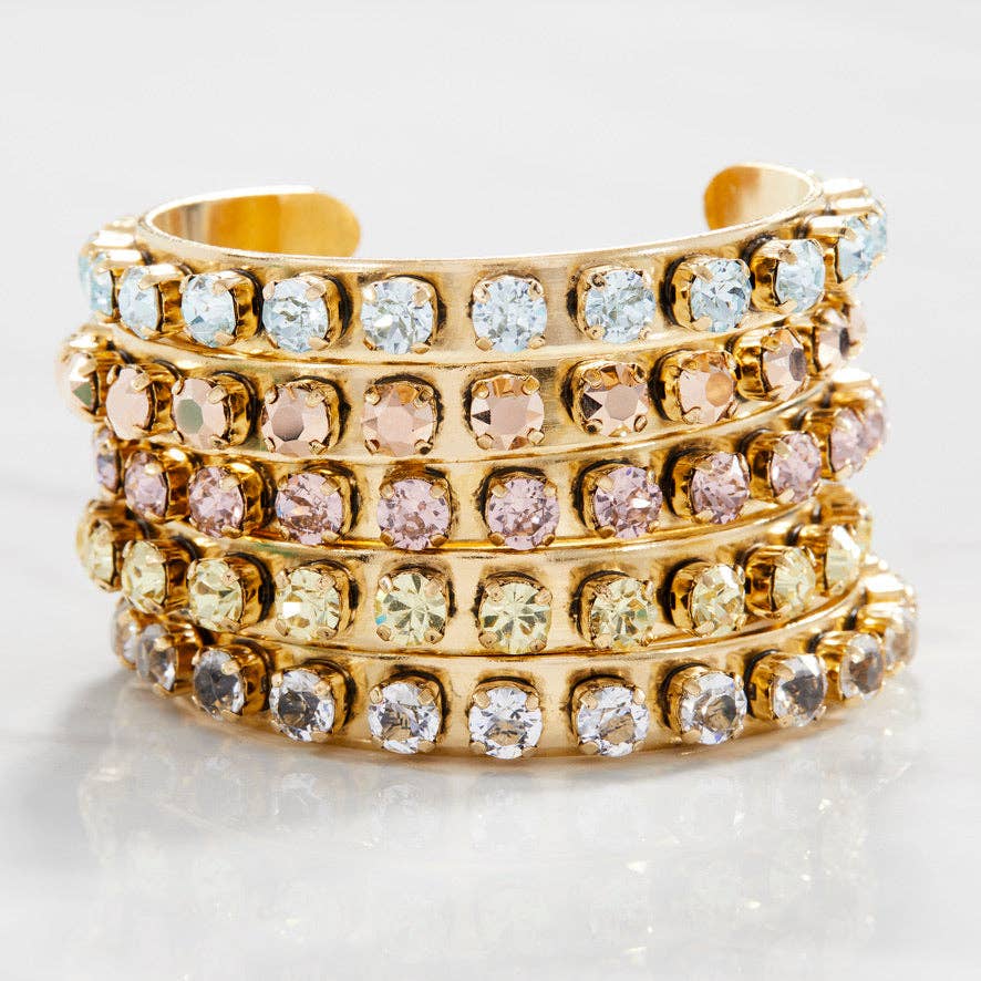 Close-up of the pink crystal setting and antique gold finish on the Kelly cuff bracelet