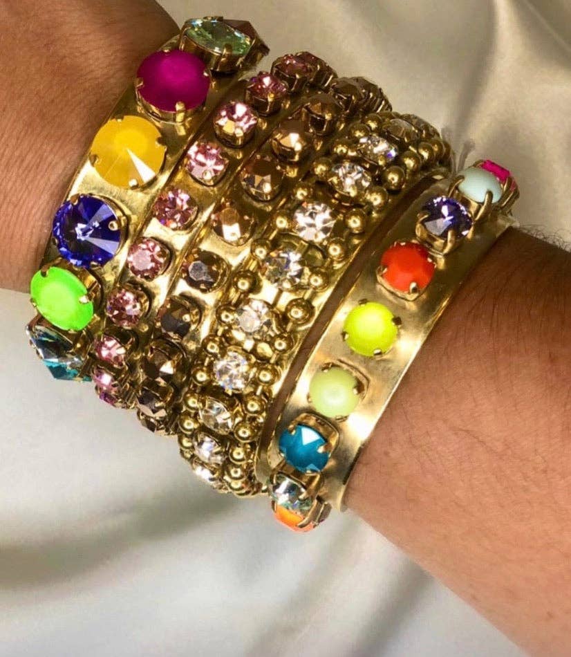 Side view showing the open back and 2.5 inch diameter of the blue Kelly cuff bracelet
