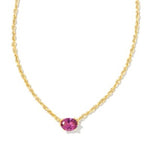 Gold necklace with a pink gemstone on a white background
