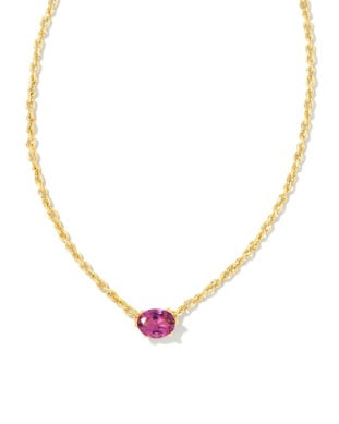 Gold necklace with a pink gemstone on a white background