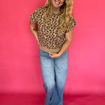 Back view of the leopard print cap sleeve knit top showing the mock neck and regular fit