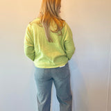 Detail of the mid to high rise waistband and belt loops on the charcoal dad jeans